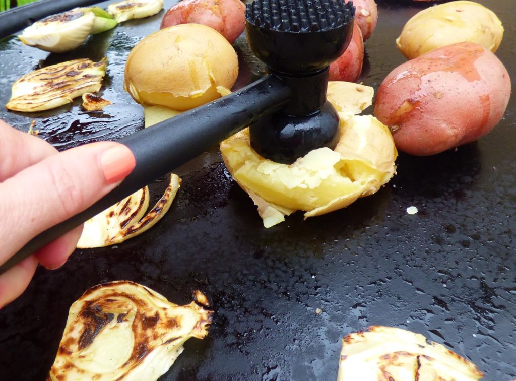 Evo grills flat top surface allows direct smashing of potatoes